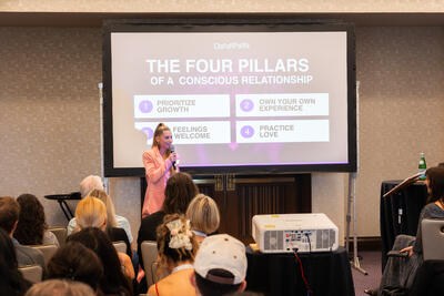 Christina Weber presenting The Four Pillars of a Conscious Relationship framework at Beyond Biohacking Conference
