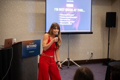 Christina Weber delivering her keynote on stage at Beyond Biohacking Conference