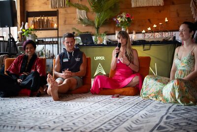 Christina Weber speaking on the mic during the Biohacking Love panel