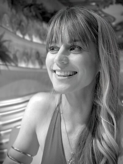 Black and white candid portrait of Christina Weber laughing