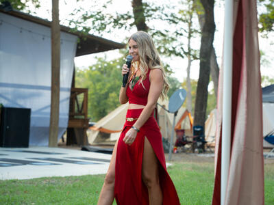 Christina Weber walking with microphone at Solar Punk Summit